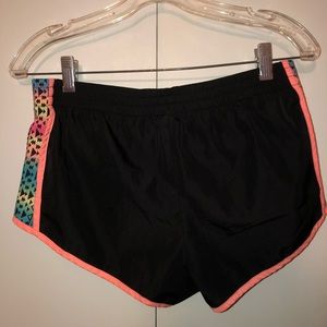 Athletic shorts with tribal design on sides.